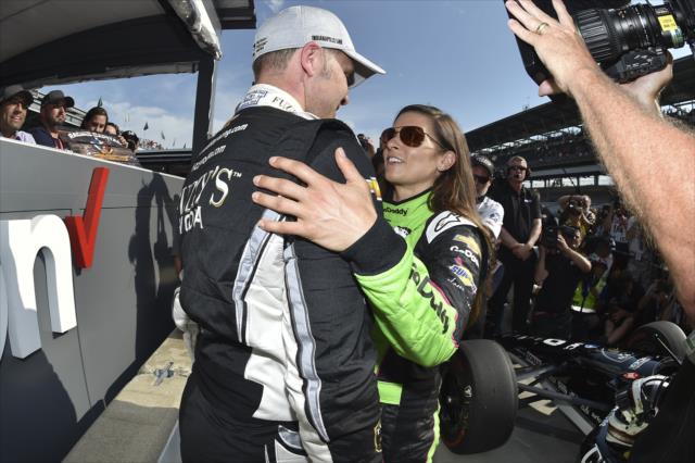 Ed Carpenter is congratulated by teammate Danica Patrick on pit lane after winning the pole position for the 102nd Indianapolis 500 at the Indianapolis Motor Speedway -- Photo by: Chris Owens