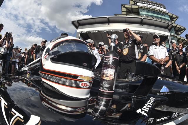 The helmet of Ed Carpenter sits on the No. 20 Fuzzy's Vodka Chevrolet on pit lane after winning the pole position for the 102nd Indianapolis 500 at the Indianapolis Motor Speedway -- Photo by: Chris Owens