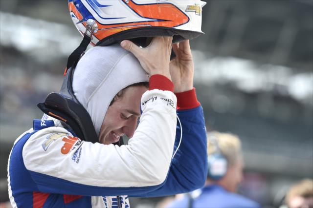 Matheus 'Matt' Leist slides on his helmet prior to his qualification attempt for the 102nd Indianapolis 500 at the Indianapolis Motor Speedway -- Photo by: Chris Owens