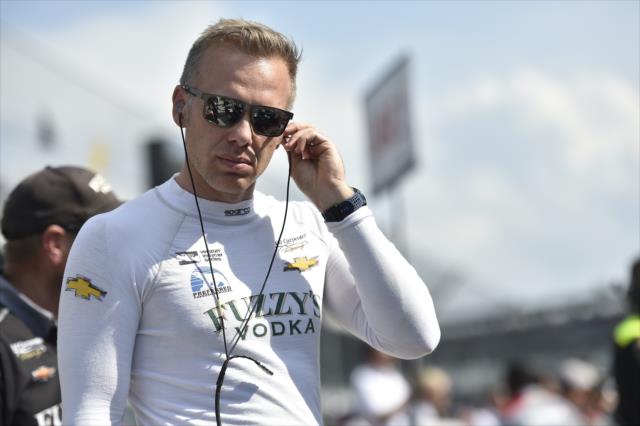 Ed Carpenter sets his earpieces along pit lane prior to his qualification attempt for the 102nd Indianapolis 500 at the Indianapolis Motor Speedway -- Photo by: Chris Owens
