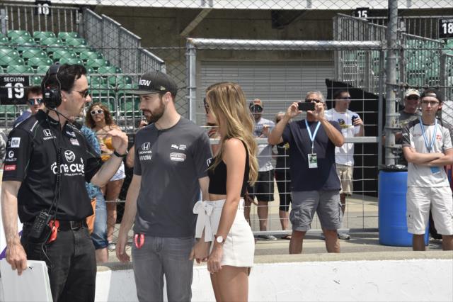 James Hinchcliffe and his girlfriend,  Becky, chat with a Schmidt Peterson Motorsports crewman during qualifications for the 102nd Indianapolis 500 at the Indianapolis Motor Speedway -- Photo by: Jim Haines