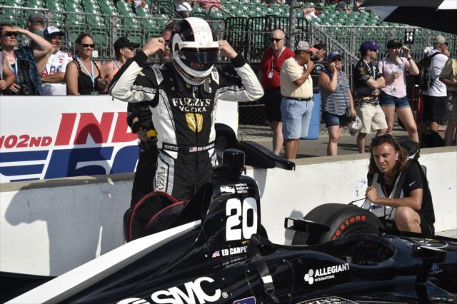 Ed Carpenter starts taking off his helmet on pit lane following qualification attempt for the 102nd Indianapolis 500 at the Indianapolis Motor Speedway -- Photo by: Jim Haines