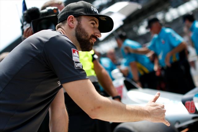 James Hinchcliffe gives the hangloose sign to his fellow racers along pit lane during qualifications for the 102nd Indianapolis 500 at the Indianapolis Motor Speedway -- Photo by: Joe Skibinski