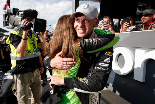 Ed Carpenter hugs teammate Danica Patrick after taking pole position for the 102nd Indianapolis 500 -- Photo by: Joe Skibinski