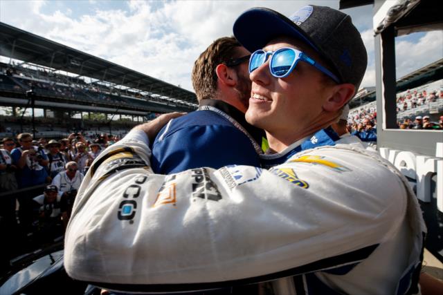 Spencer Pigot is congratulated on pit lane by his team following his qualification attempt for the 102nd Indianapolis 500 at the Indianapolis Motor Speedway -- Photo by: Joe Skibinski