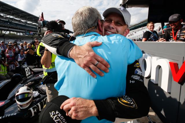 Ed Carpenter gets a big hug from Fuzzy Zoeller on pit lane after winning the pole position for the 102nd Indianapolis 500 at the Indianapolis Motor Speedway -- Photo by: Joe Skibinski