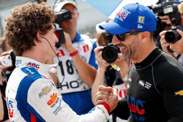 Tony Kanaan and Matheus 'Matt' Leist congratulate each other for their respective qualifying runs for the 102nd Indianapolis 500 at the Indianapolis Motor Speedway -- Photo by: Joe Skibinski