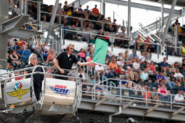 Flagman Paul Blevin waives the green flag to begin qualifications for the 102nd Running of the Indianapolis 500 -- Photo by: Joe Skibinski