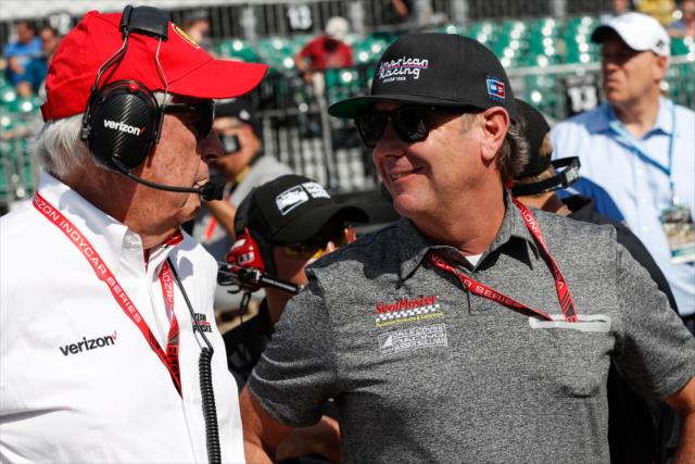 Team owners Roger Penske and Jimmy Vasser chat on pit lane during qualifications for the 102nd Indianapolis 500 at the Indianapolis Motor Speedway -- Photo by: Joe Skibinski