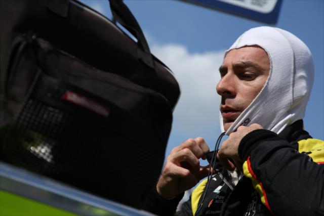 Simon Pagenaud adjusts his balaclava along pit lane prior to his qualification attempt for the 102nd Indianapolis 500 at the Indianapolis Motor Speedway -- Photo by: Matt Fraver