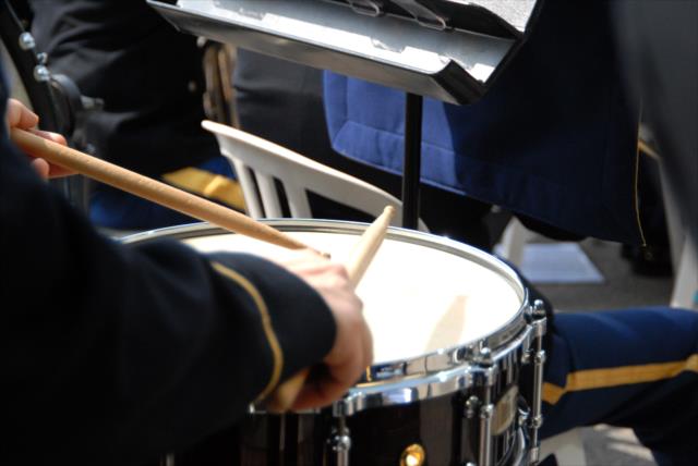 A 38th Infantry Division Band Member taps his snare drum during the Sunday morning enlistment ceremony at the Indianapolis Motor Speedway -- Photo by: Mike Young