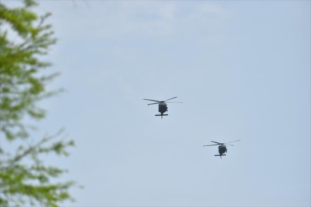 Military helicopters fly over the Indianapolis Motor Speedway during Armed Services Day at the Indianapolis Motor Speedway -- Photo by: Mike Young