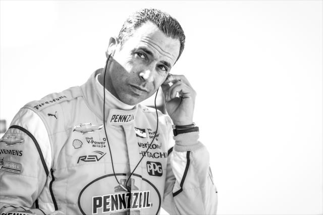 Helio Castroneves sets his earpieces along pit lane prior to the final practice for the 102nd Indianapolis 500 at the Indianapolis Motor Speedway -- Photo by: Chris Owens