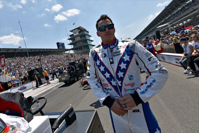 Graham Rahal zips up his firesuit along pit lane prior to his run in the 2018 pit stop competition during Miller Lite Carb Day at the Indianapolis Motor Speedway -- Photo by: John Cote
