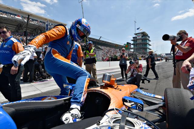 Scott Dixon steps into his No. 9 PNC Bank Honda on pit lane prior to his run during the 2018 pit stop competition on Miller Lite Carb Day at the Indianapolis Motor Speedway -- Photo by: John Cote