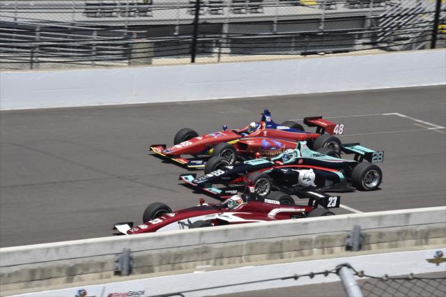 Victor Franzoni, Dalton Kellett and Ryan Norman go three-wide down the frontstretch during the 2018 Freedom 100 at the Indianapolis Motor Speedway -- Photo by: Jim Haines