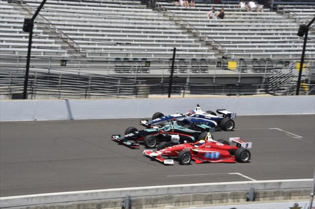 Santi Urrutia, Dalton Kellett, and Colton Herta go three-wide down the frontstretch during the 2018 Freedom 100 at the Indianapolis Motor Speedway -- Photo by: Jim Haines