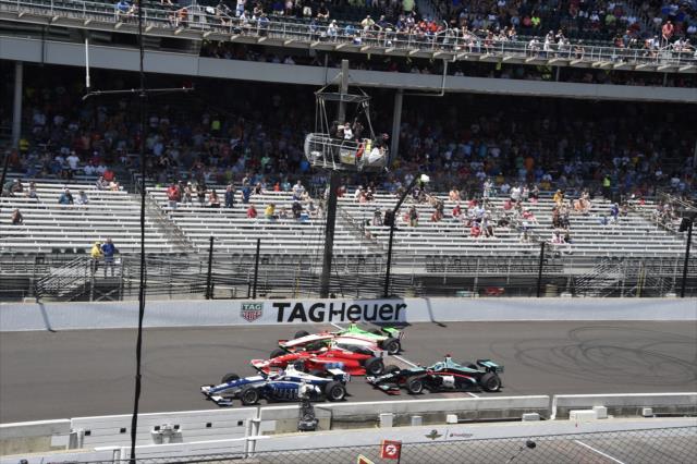 Colton Herta, Santi Urrutia, Pato O'Ward, and Dalton Kellett all bunched up taking the white flag during the 2018 Freedom 100 at the Indianapolis Motor Speedway -- Photo by: Jim Haines
