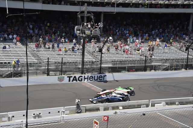 Dalton Kellett takes the twin-checkers to win the 2018 Freedom 100 at the Indianapolis Motor Speedway -- Photo by: Jim Haines
