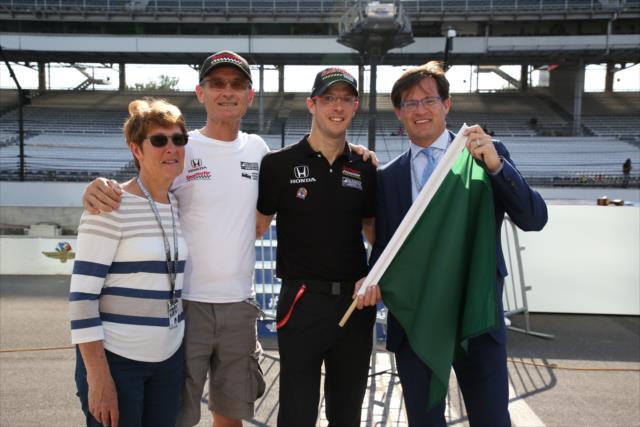 Sebastien Bourdais and his parents deliver the green flag to Indianapolis Motor Speedway president Doug Boles on Miller Lite Carb Day -- Photo by: Matt Fraver