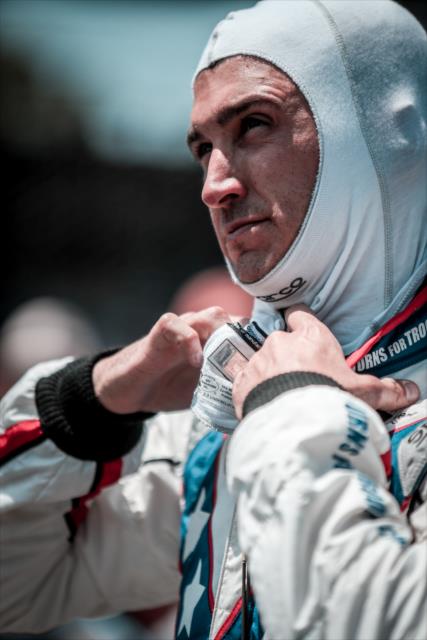 Graham Rahal adjust his firesuit along pit lane prior to his run in the 2018 pit stop competition on Miller Lite Carb Day at the Indianapolis Motor Speedway -- Photo by: Shawn Gritzmacher