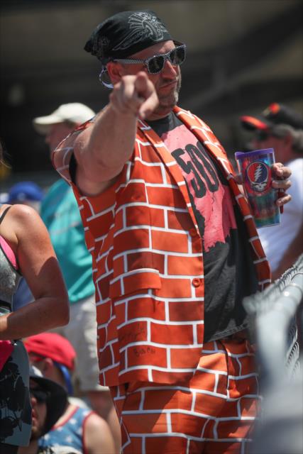 A fan knows where the action is on track during the final practice on Miller Lite Carb Day at the Indianapolis Motor Speedway -- Photo by: Shawn Gritzmacher
