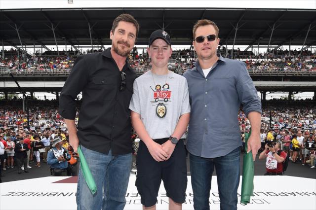 Christian Bale and Matt Damon receive the green flags for the 103rd Running of the Indianapolis 500 presented by Gainbridge from Trey Edens. -- Photo by: Chris Owens