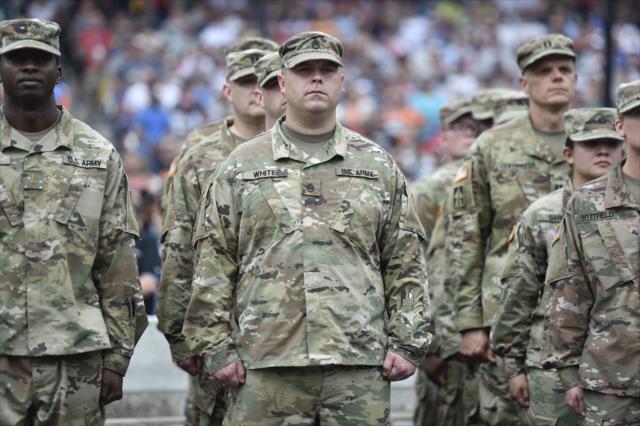 Military members stand during pre-race festivities -- Photo by: Chris Owens