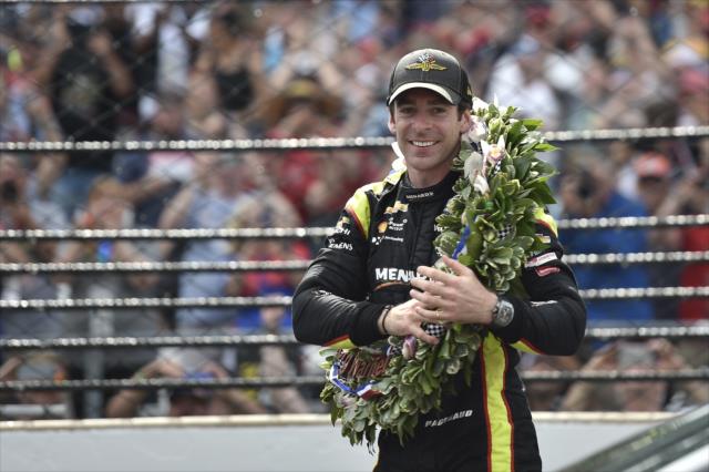 Simon Pagenaud celebrates at the Yard of Bricks after winning the 103rd Indianapolis 500 presented by Gainbridge -- Photo by: Chris Owens