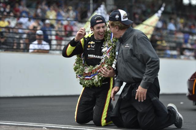 Simon Pagenaud celebrates with John Menard Jr on the Yard of Bricks after winning the 103rd Indianapolis 500 presented by Gainbridge -- Photo by: Chris Owens