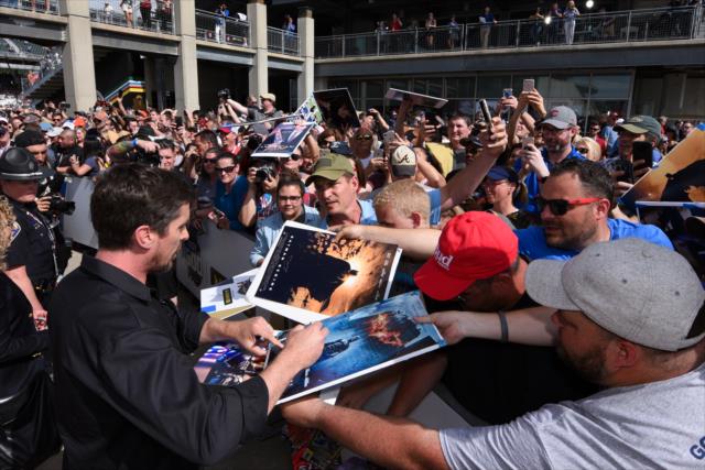 Christian Bale signs autographs on the red carpet at the 103rd Running of the Indianapolis 500 presented by Gainbridge -- Photo by: James  Black
