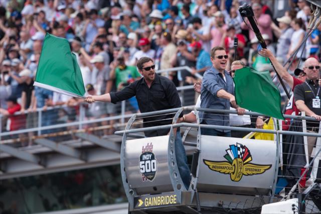 Christian Bale and Matt Damon wave the green flag -- Photo by: James  Black