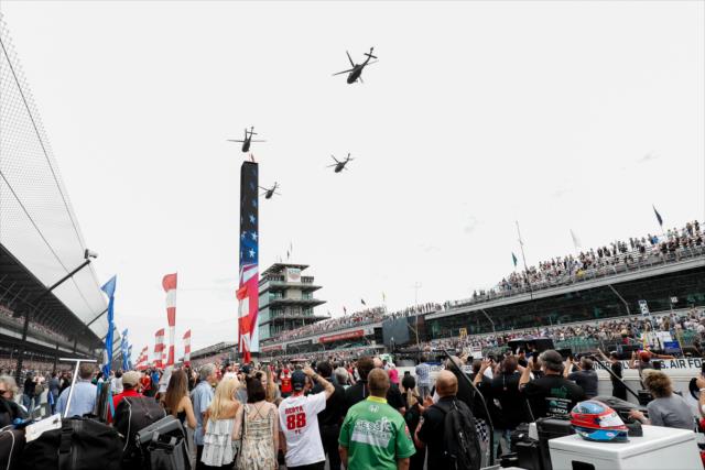 Military flyover during the pre-race festivities. -- Photo by: Joe Skibinski