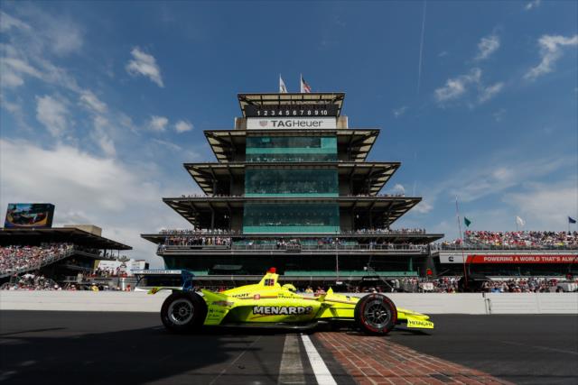 Simon Pagenaud stopped at the Yard of Bricks after winning the 103rd Running of the Indianapolis 500 presented by Gainbridge -- Photo by: Joe Skibinski