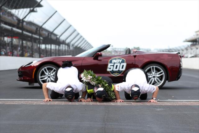 Simon Pagenaud kisses the bricks after winning the 103rd Running of the Indianapolis 500 presented by Gainbridge -- Photo by: Joe Skibinski