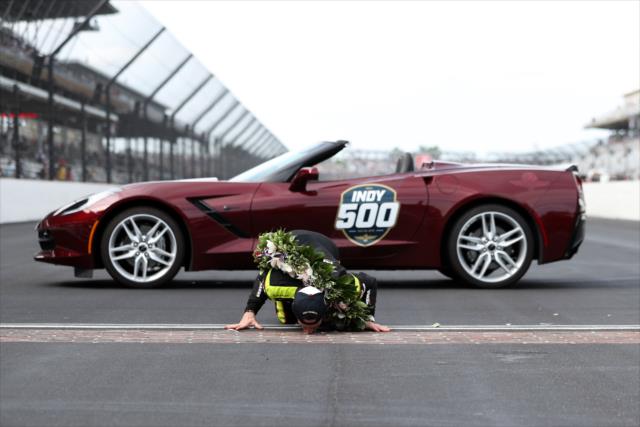 Simon Pagenaud kisses the bricks after winning the 103rd Running of the Indianapolis 500 presented by Gainbridge -- Photo by: Joe Skibinski