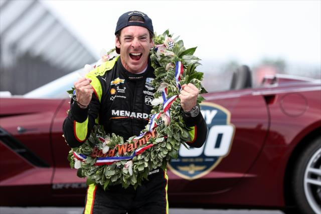 Simon Pagenaud celebrates at the Yard of Bricks after winning the 103rd Running of the Indianapolis 500 presented by Gainbridge -- Photo by: Joe Skibinski