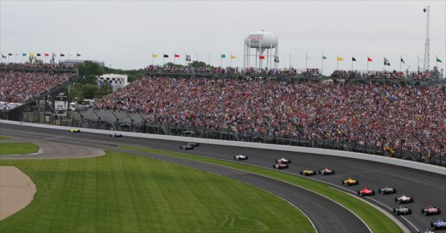 The field races through turn one on the first lap of the 103rd Running of the Indianapolis 500 presented by Gainbridge -- Photo by: Richard Dowdy