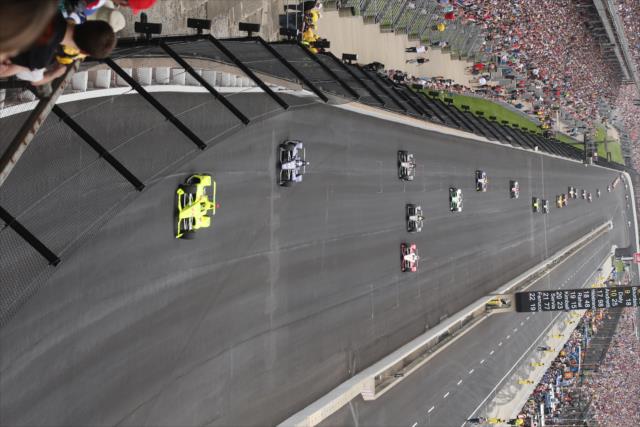 Simon Pagenaud leads the field during the opening laps of the 103rd Running of the Indianapolis 500 presented by Gainbridge -- Photo by: Richard Dowdy