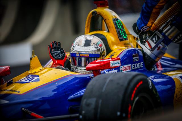 Alexander Rossi slams his hands after a mechanical issue during a pit stop -- Photo by: Shawn Gritzmacher