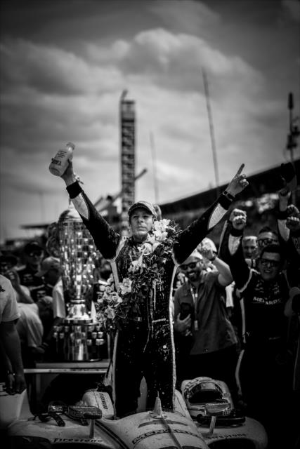 Simon Pagenaud celebrates in Victory Circle after winning the 103rd Running of the Indianapolis 500 presented by Gainbridge -- Photo by: Shawn Gritzmacher