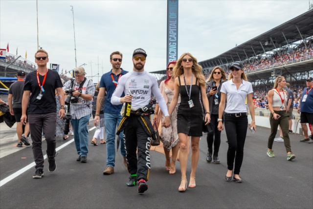 James Hinchcliffe walks to drivers introductions with his fiancÃ© Becky Dalton and entourage. -- Photo by: Stephen King