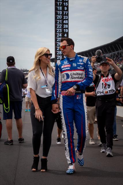 Graham Rahal and Courtney Force make their way down pitlane towards drivers introductions -- Photo by: Stephen King