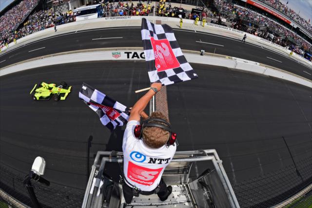 Simon Pagenaud receives the twin checkered flags to win the 103rd Running of the Indianapolis 500 presented by Gainbridge -- Photo by: Walter Kuhn