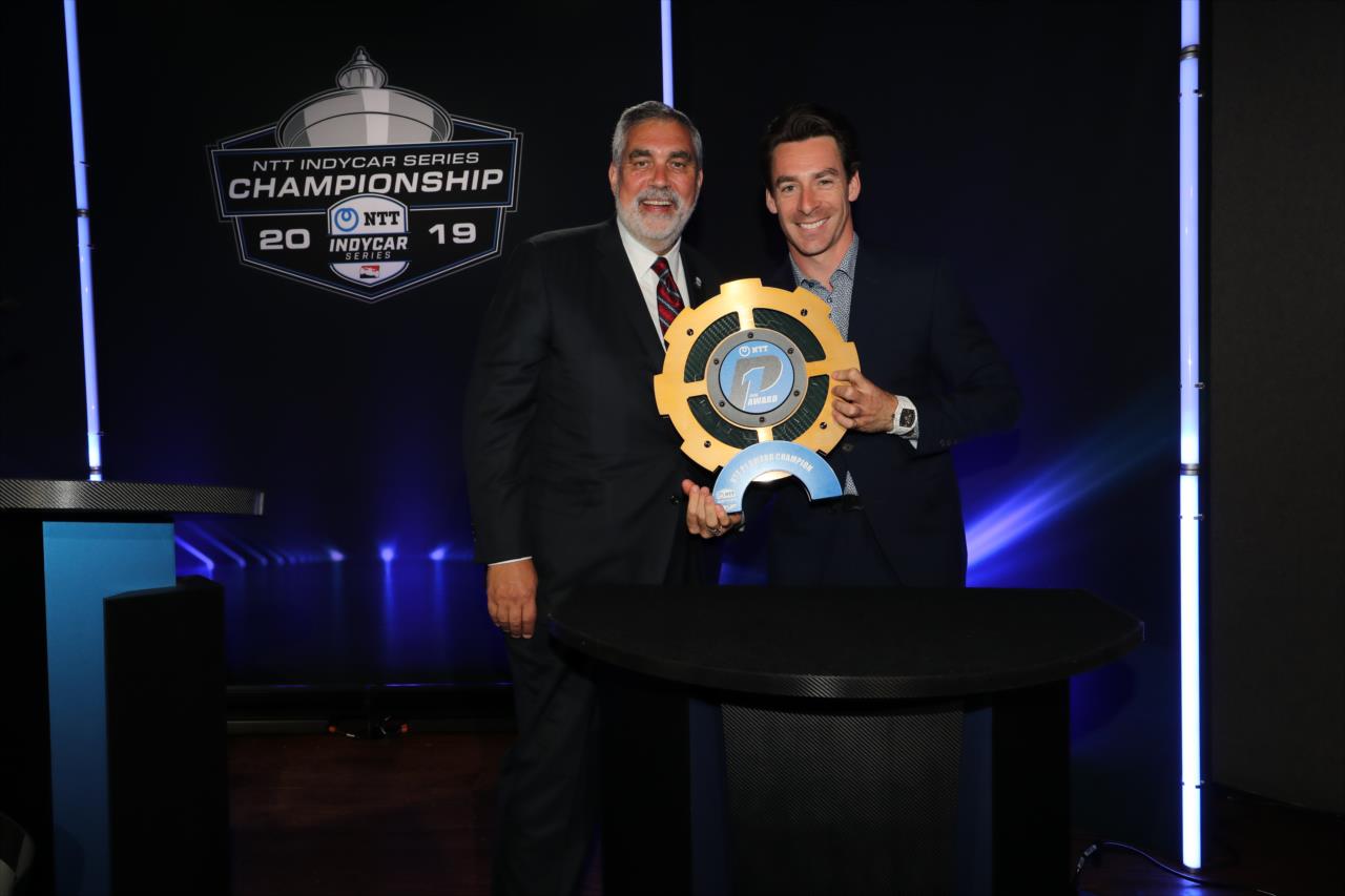 Simon Pagenaud receives his NTT P1 Award trophy during the Victory Lap Celebration at Union 50 in downtown Indianapolis -- Photo by: Chris Owens