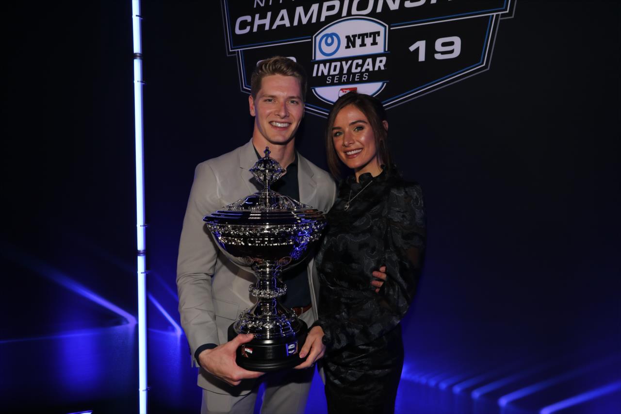 Joseph Newgarden with fiancee Ashley Welch and his Astor Cup prior to the Victory Lap Celebration at Union 50 in downtown Indianapolis -- Photo by: Chris Owens