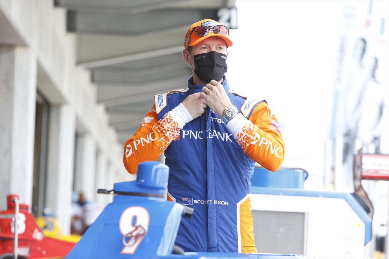 Scott Dixon adjusts his firesuit back in the paddock area prior to practice for the GMR Grand Prix on the Indianapolis Motor Speedway Road Course -- Photo by: Chris Jones