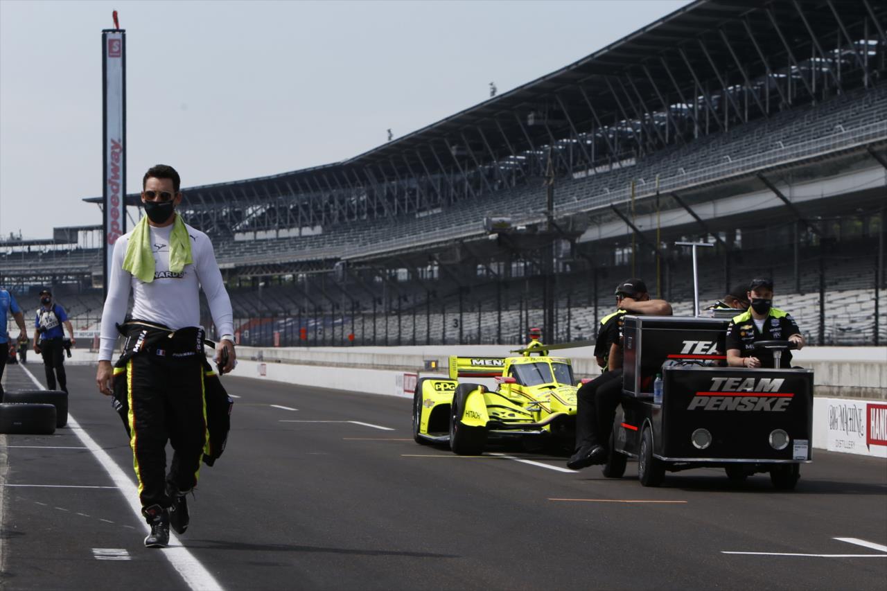 Simon Pagenaud walks down pit lane ahead of his No. 22 Menards Chevrolet prior to practice for the GMR Grand Prix on the Indianapolis Motor Speedway Road Course -- Photo by: Chris Jones