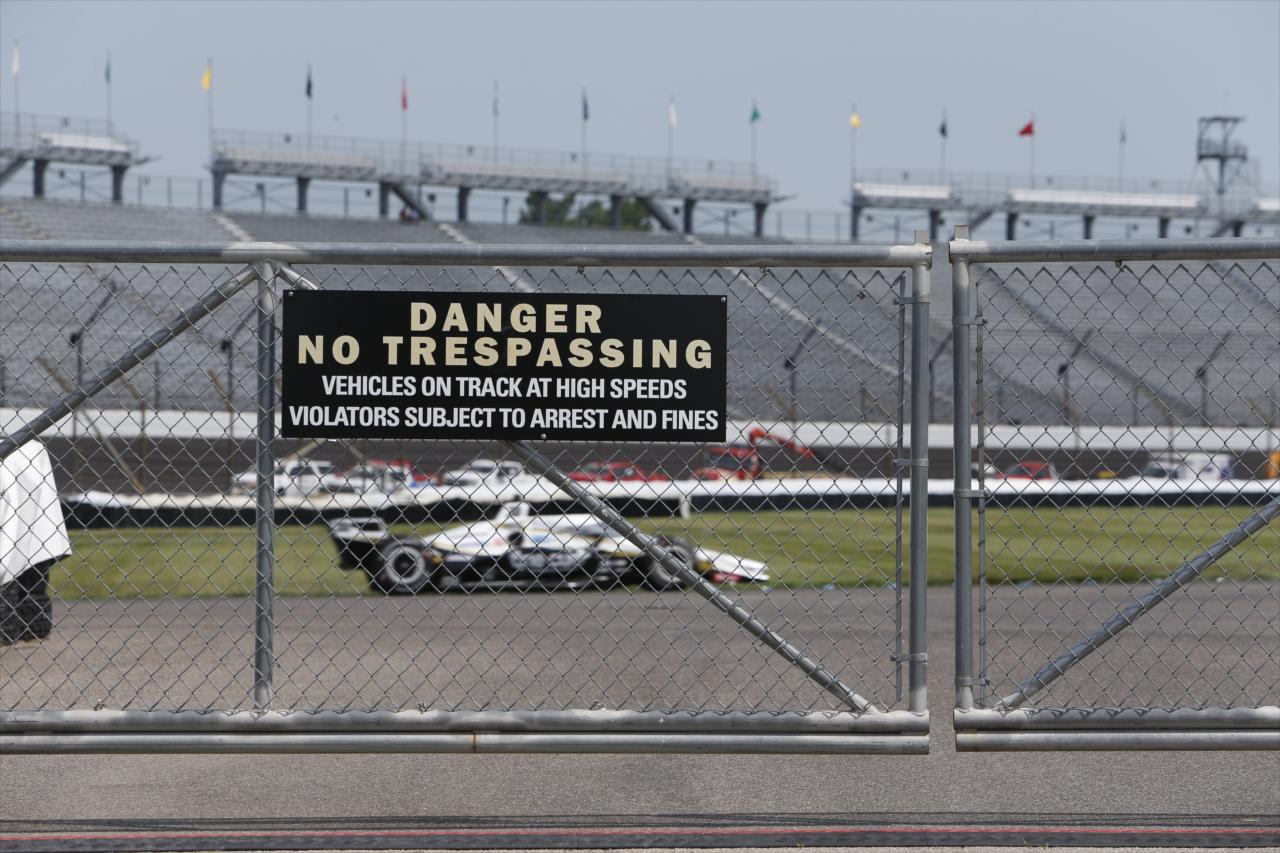Takuma Sato flashes by track gate during practice for the GMR Grand Prix on the Indianapolis Motor Speedway Road Course -- Photo by: Chris Jones