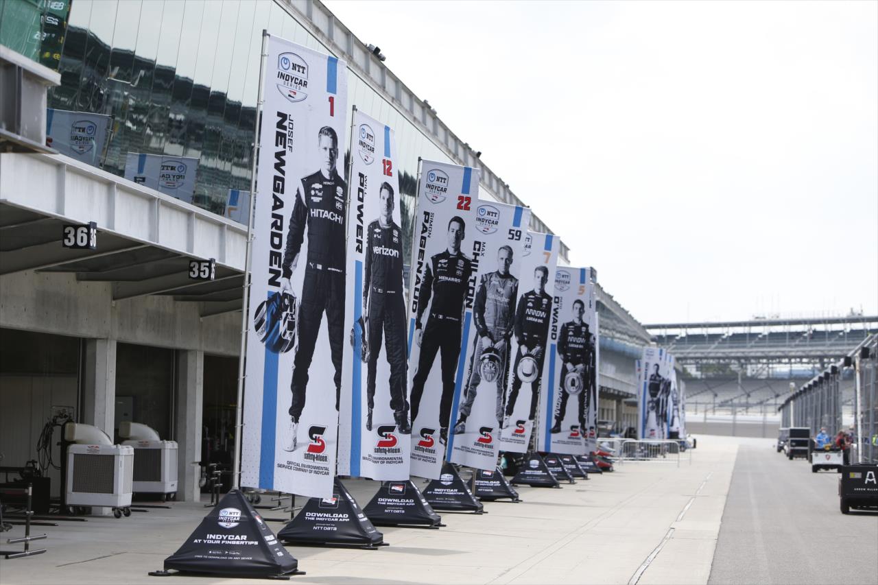 Driver flags fly along the paddock for the GMR Grand Prix on the Indianapolis Motor Speedway Road Course -- Photo by: Chris Jones